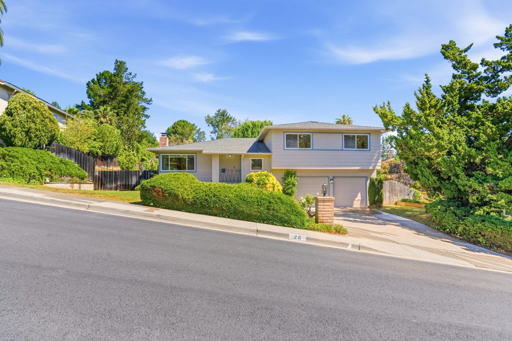 Front exterior of Pleasant Hill home on quiet court with landscaped yard and attached garage